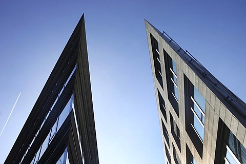 Colonius-Carre office buildings, against blue sky with contrails, Ehrenfeld district, Cologne, North Rhine-Westphalia, Germany, Europe