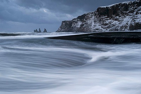 The Reynisdrangar pinnacles on the wintry Reynisfjara beach at Vik I Myrdal, Iceland, Europe