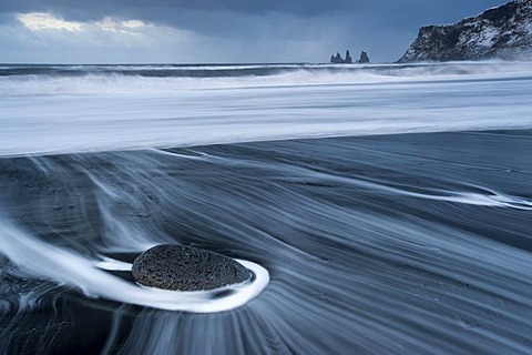 The Reynisdrangar pinnacles on the wintry Reynisfjara beach at Vik I Myrdal, Iceland, Europe