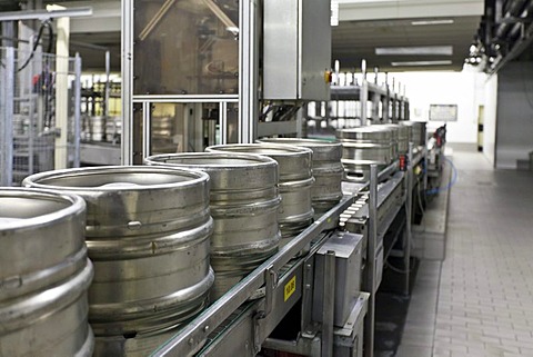 Beer kegs on a conveyor belt, waiting to be filled, Binding brewery, Frankfurt, Hesse, Germany, Europe