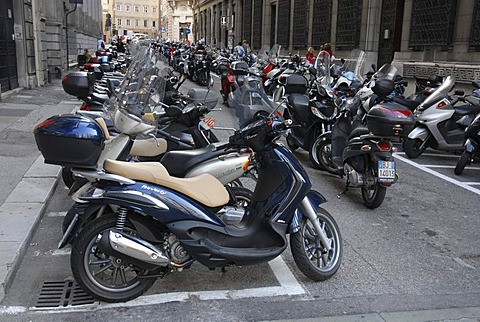 Parking area for motorcycles and motor scooters in the historic district of Trieste, Italy, Europe