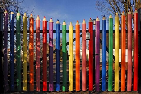 Large coloured pencils forming the gate of the A. Mozart School, Rue de l'Hotel de Ville, Marckolsheim, Alsace, France, Europe