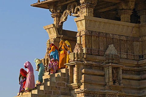 Women wearing saris leaving Kandariya Mahadev Temple, Khajuraho Group of Monuments, UNESCO World Heritage Site, Madhya Pradesh, India, Asia