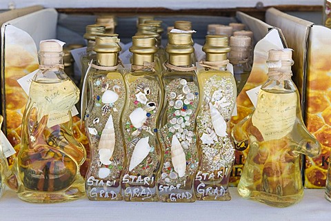 Local specialties and souvenirs on sale at a market stall in the town of Stari Grad, island of Hvar, Dalmatia, Croatia, Europe