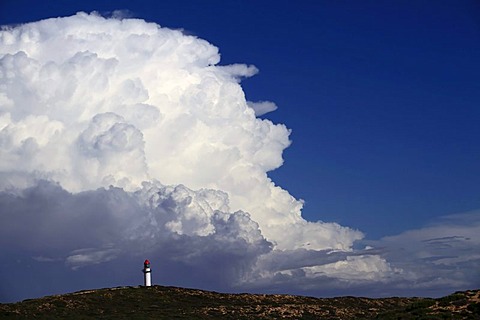 Point Quobba Lighthouse with big rain cloud in the distance, Western Australia