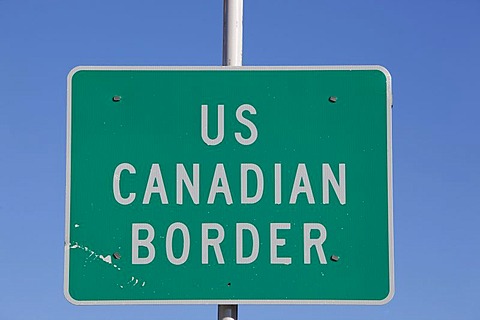 US - Canadian border crossing sign, White Pass, south Klondike Highway, Alaska and British Columbia, B. C., Canada