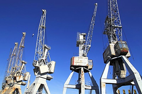 Old disused cranes in the free port, Hamburg, Germany