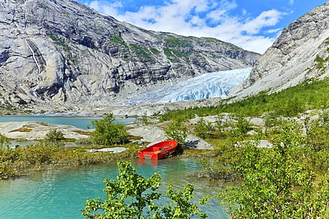 Red boat, Nigardsbreen, Jostedalen valley, Luster, Sogn og Fjordane county, Norway, Europe