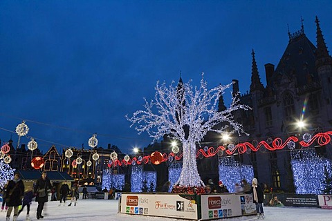 The ice rink on the Grote Markt market square in winter, Bruges, Brugge, West Flanders, Flemish Region, Belgium, Europe