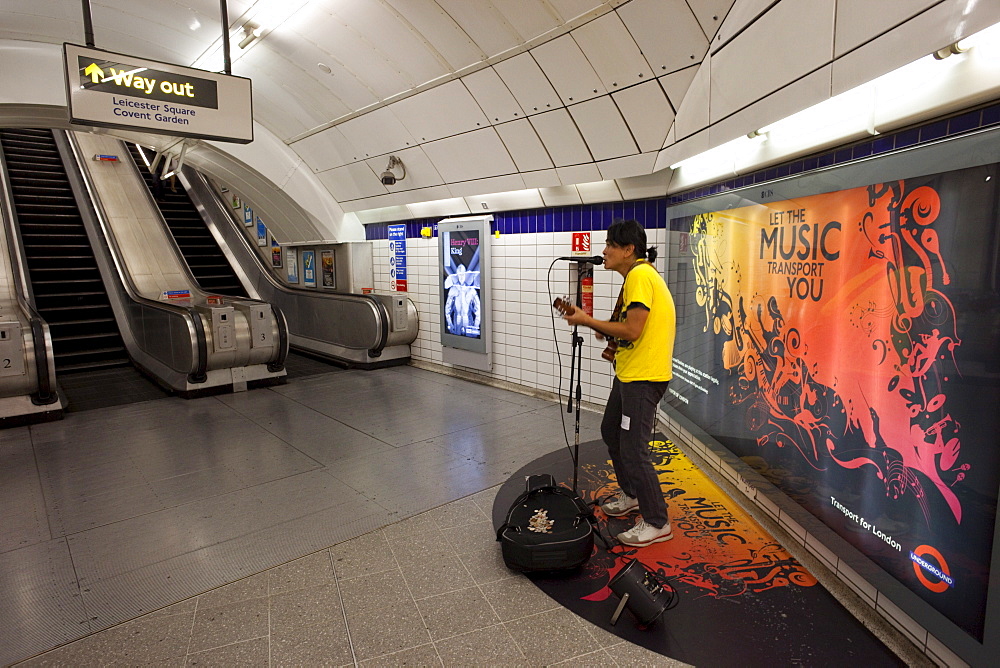 Busker in Underground Station, London, England, United Kingdom, Europe