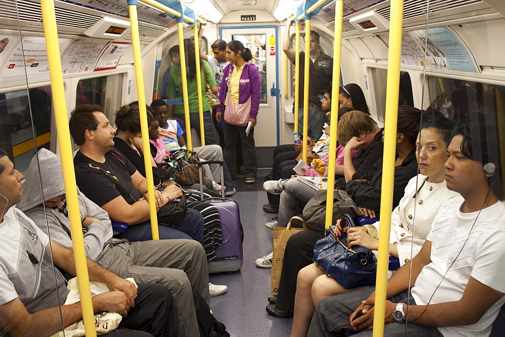 Passengers on an underground train, London, England, United Kingdom, Europe