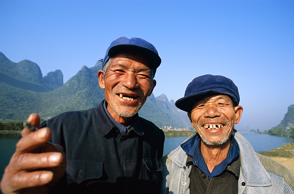 Two local men dressed in Mao suits, Guilin, Yangshou, Guangxi Province, China, Asia