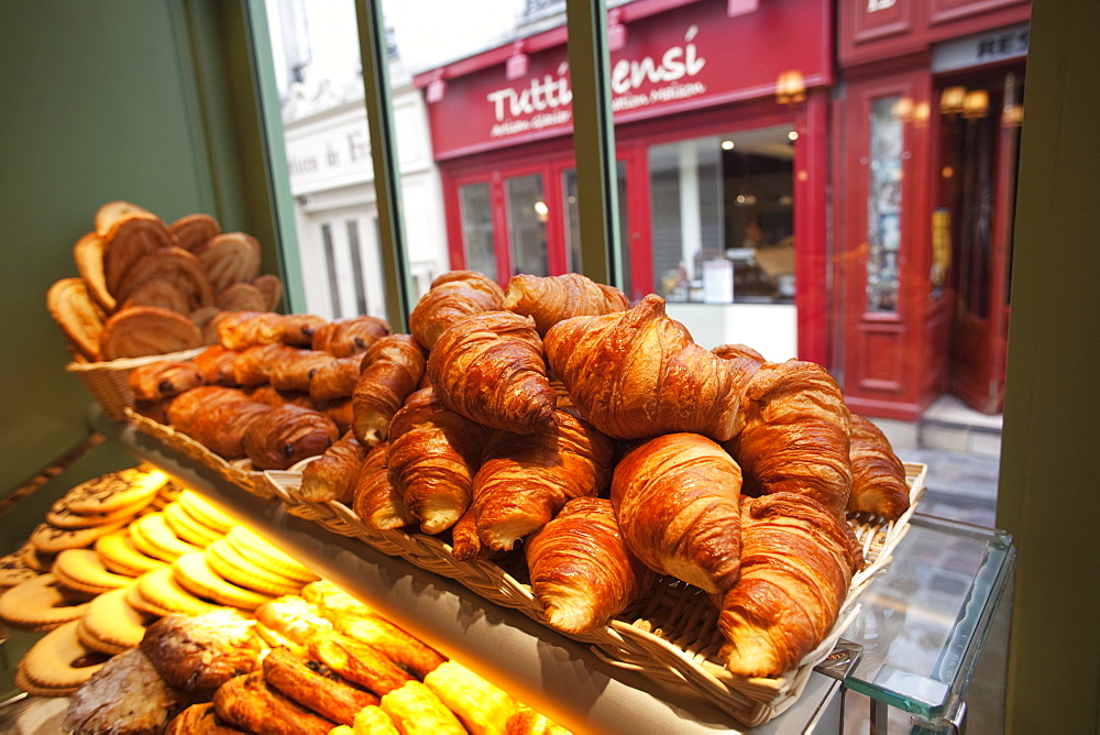 Croissants and pastries on display in patisserie shop, Paris, France, Europe