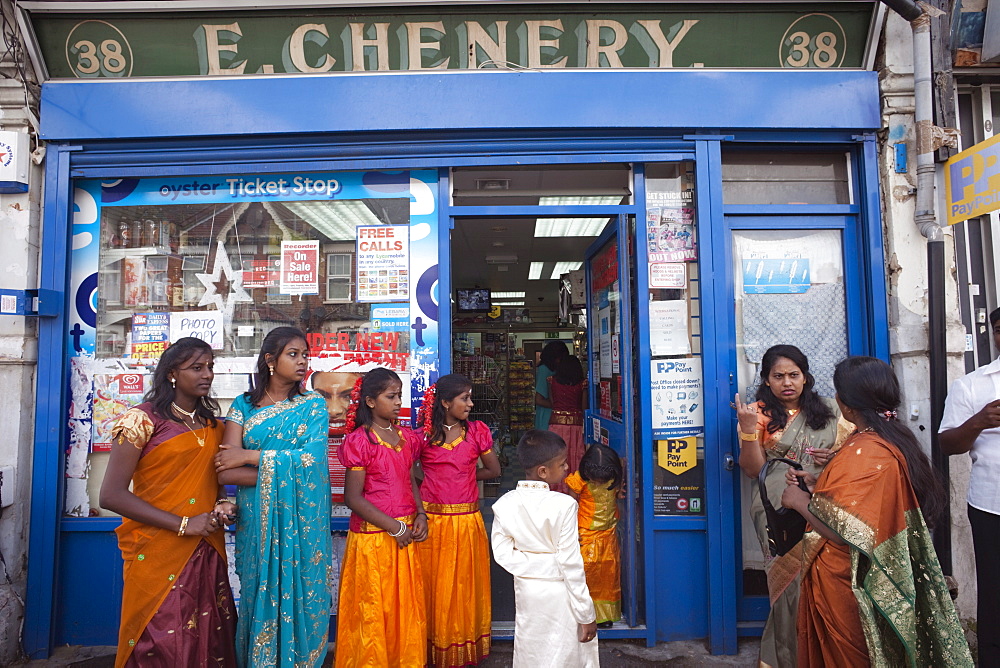 Customers outside Convenience Store, Stratford, London, England, United Kingdom, Europe