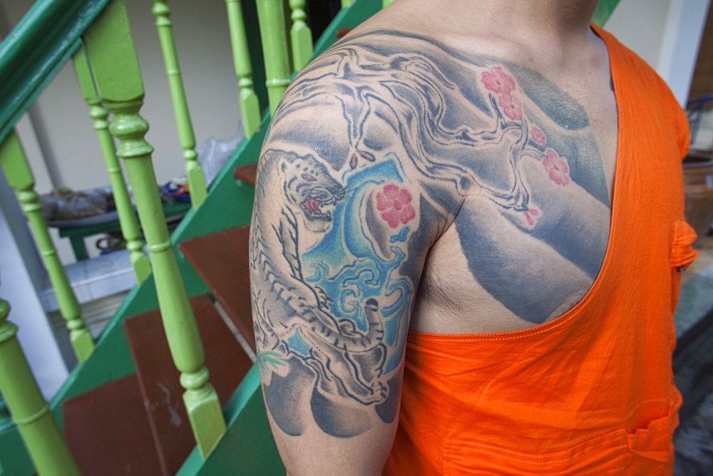 Monk with tiger tatoo on upper arm, Bangkok, Thailand, Southeast Asia, Asia