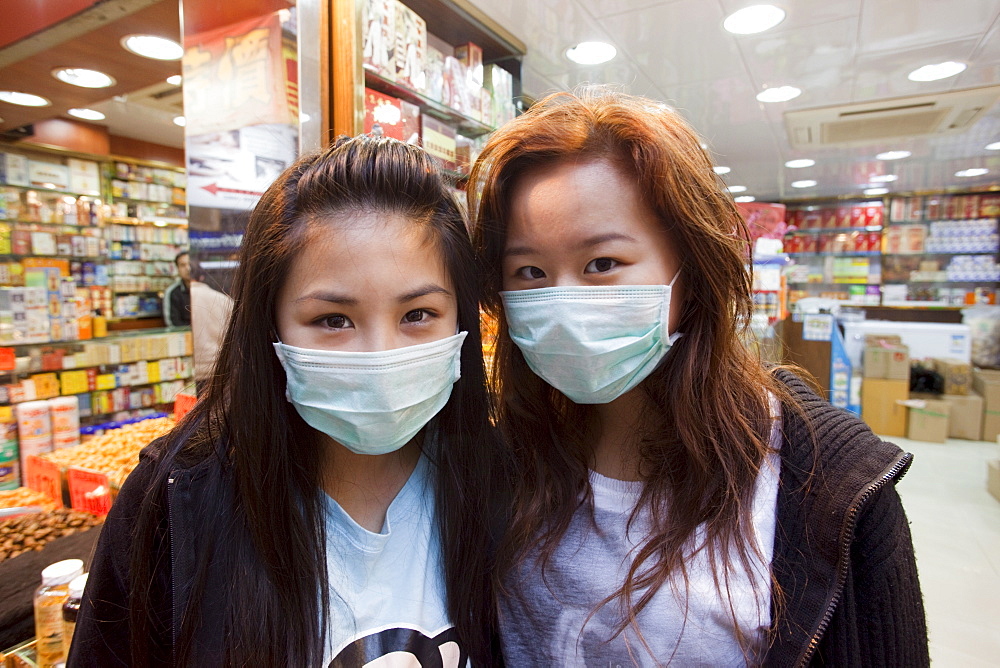 Girls wearing flu masks, Hong Kong, China, Asia