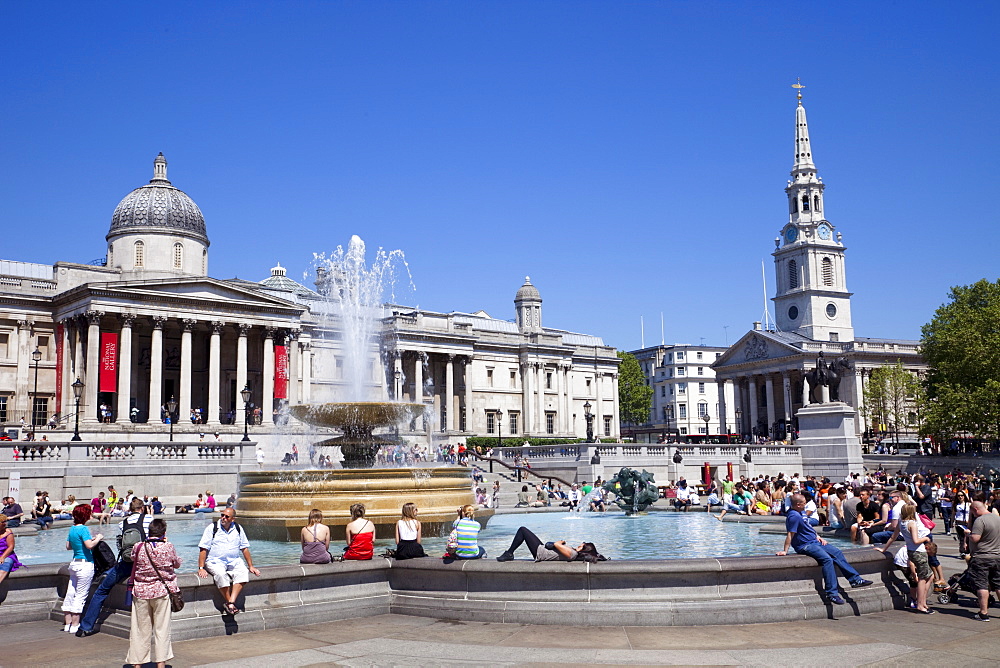 Fountain and tourists, Trafalgar Square, London, England, United Kingdom, Europe