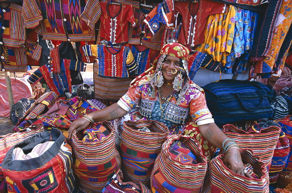 Gypsy vendor selling local crafts, Anjuna Market, Goa, India, Asia