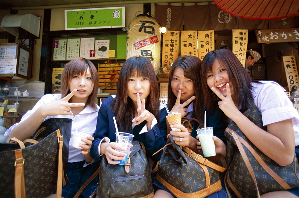 Japanese school girls with Louis Vuitton bags, Tokyo, Honshu, Japan, Asia