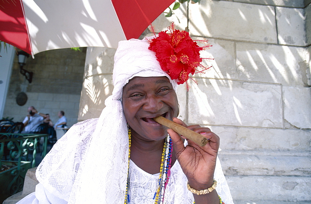 Woman smoking cigar, Havana (Habana), Cuba, West Indies, Central America