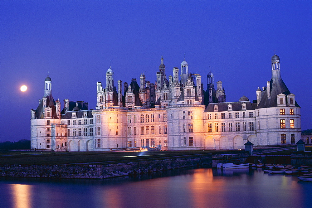 Chambord Castle (Chateau de Chambord) and Closson River at night, UNESCO World Heritage Site, Chambord, Loir et Cher, Loire Valley, France, Europe