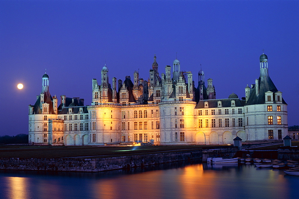 Chambord Castle (Chateau de Chambord) and Closson River at night, UNESCO World Heritage Site, Chambord, Loir et Cher, Loire Valley, France, Europe