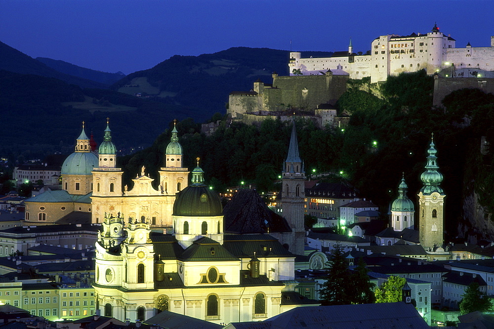 City skyline with cathedral and castle at night Salzburg, Austria, Europe