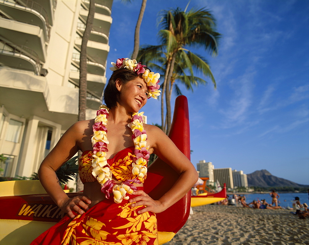 Hawaiian girl wearing leis on beach, Waikiki Beach and Diamond Head, Honolulu, Hawaii, Oahu, United States of America, North America