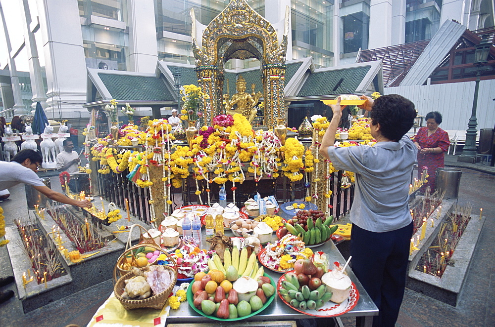 People praying and making offerings at the Erawan Shrine, Bangkok, Thailand, Southeast Asia, Asia