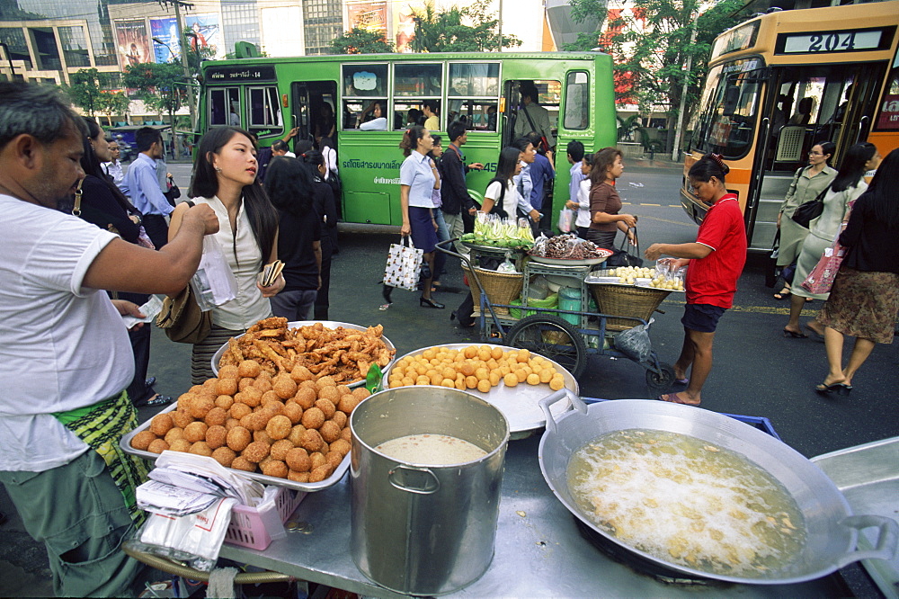 Typical street scene with buses, people and food stalls, Bangkok, Thailand, Southeast Asia, Asia