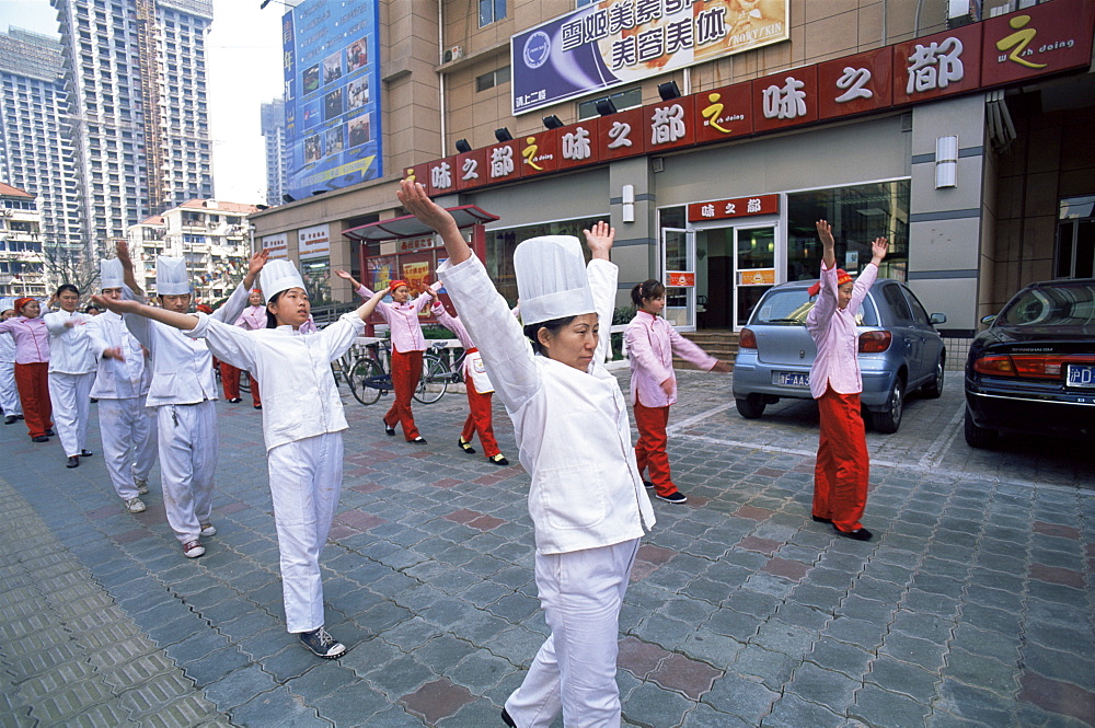 Restaurant staff performing morning exercises, Shanghai, China, Asia