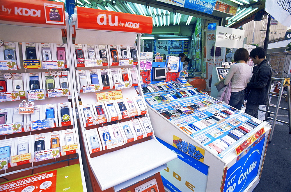 Customers at mobile phone store, Akihabara Electrical District, Tokyo, Japan, Asia