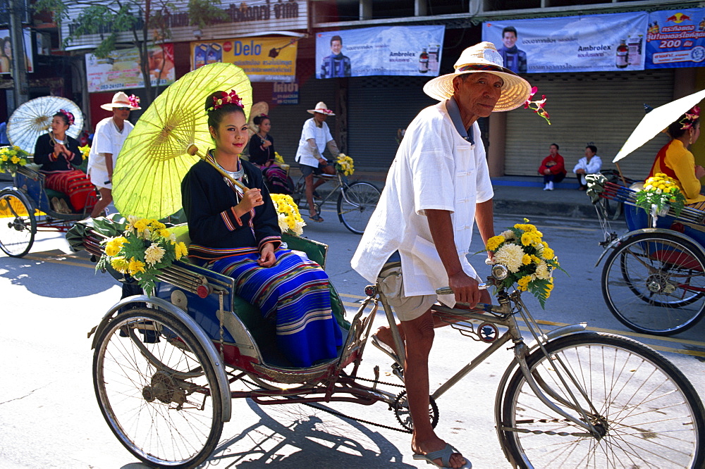 Girl sitting in trishaw at the Chiang Mai Flower Festival Parade, Chiang Mai, Thailand, Southeast Asia, Asia