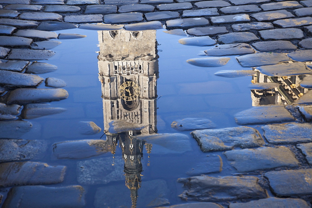 The Belfort reflected in a puddle, Ghent, Belgium, Europe