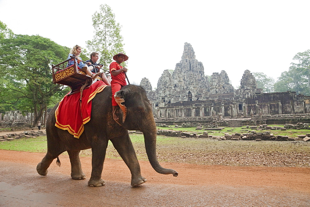 Tourists on elephant, Bayon Temple, Angkor Thom, Angkor, UNESCO World Heritage Site, Siem Reap, Cambodia, Indochina, Southeast Asia, Asia