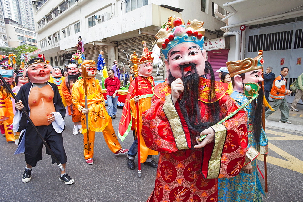 Parade participants dressed in Lucky God costumes, Tai Kok Tsui Temple Fair, Hong Kong, China, Asia