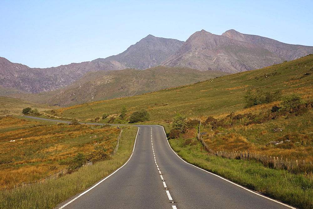 Empty road with Mount Snowdon in background, Snowdonia National Park, Gwynedd, Wales, United Kingdom, Europe