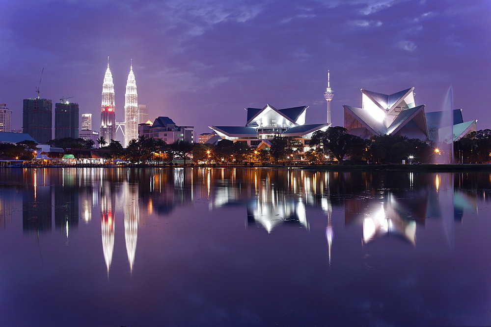 The remarkable Kuala Lumpur skyline, reflected in a lake at Titiwangsa in Kuala Lumpur, Malaysia, Southeast Asia, Asia