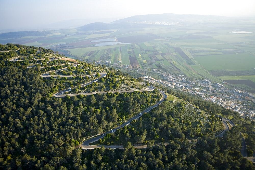 Abstract view of the road to the summit of mount Tavor in the Lower Galilee at sunrise, Israel