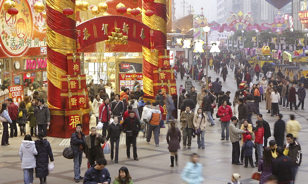 Shoppers fill a mall downtown during the traditional Chinese New Year Spring Festival, Chengdu, Sichuan, China, Asia