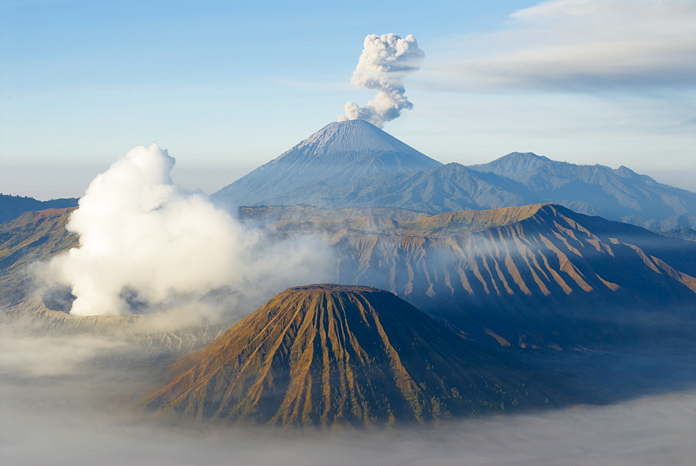 Mount Bromo, a volcano reaching 2392m, and Mount Semeru at 3676m early in the morning, Java, Indonesia, Southeast Asia, Asia