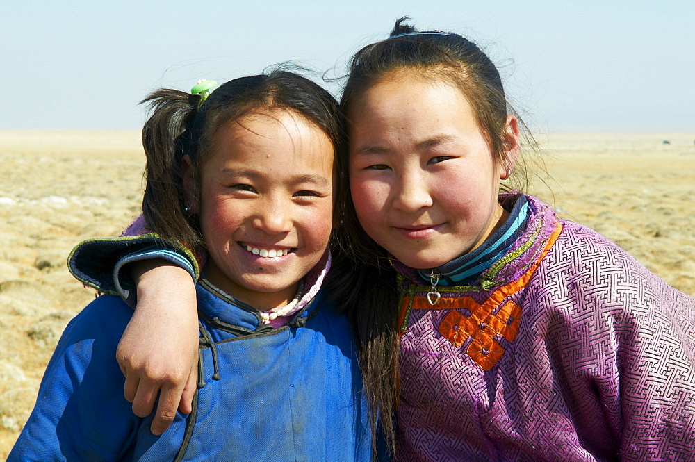 Young Mongolian girls in traditional costume (deel), Province of Khovd, Mongolia, Central Asia, Asia