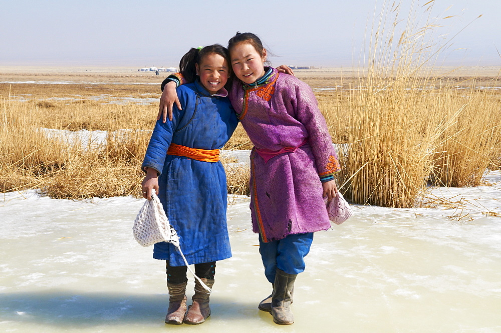 Young Mongolian girls in traditional costume (deel), Province of Khovd, Mongolia, Central Asia, Asia