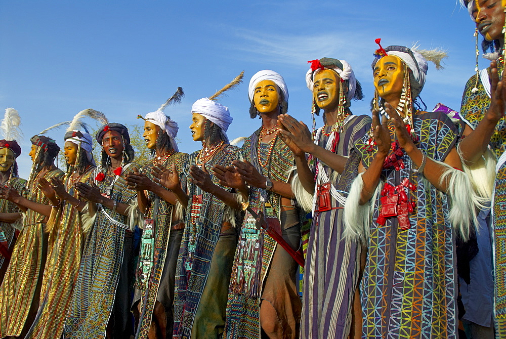 Group of Wodaabe (Bororo) men with faces painted for the annual Gerewol male beauty contest, the general reunion of West Africa for the Wodaabe Peul (Bororo Peul) people, Niger, West Africa, Africa