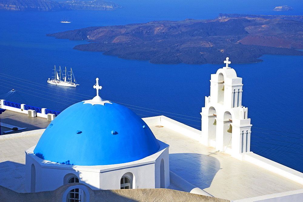 Church with blue dome overlooking the Aegean, Fira, Thira, Santorini, Cyclades, Greek Islands, Greece, Europe