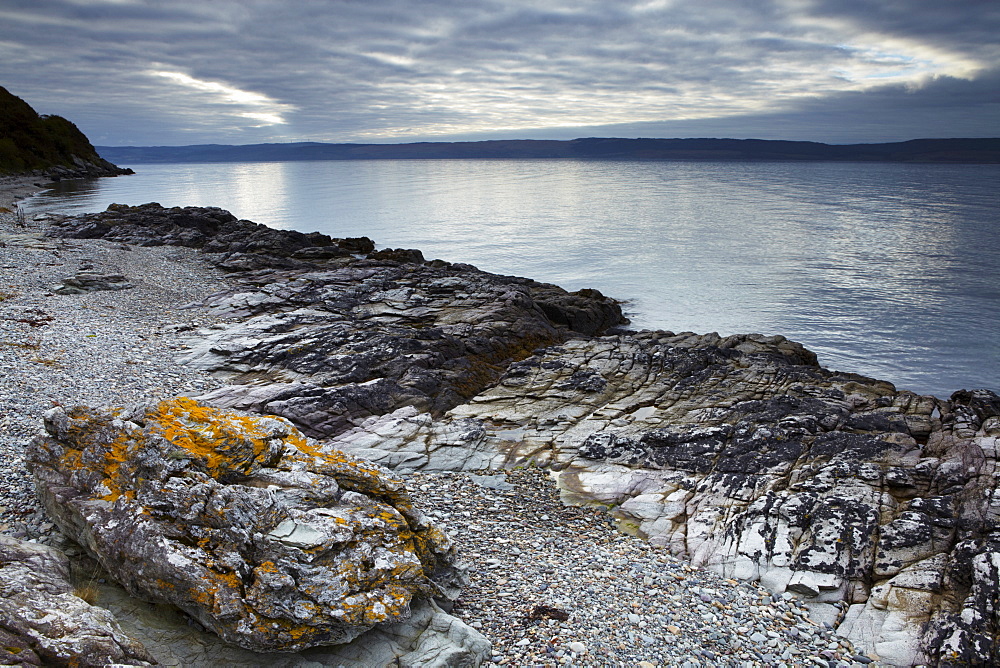 The coast of the Isle of Arran near Catacol looking across towards the Kintyre Peninsula on the Scottish mainland, Scotland, United Kingdom, Europe