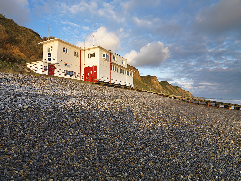 The lifeboat station and cliffs from the beach at Sheringham, Norfolk, England, United Kingdom, Europe