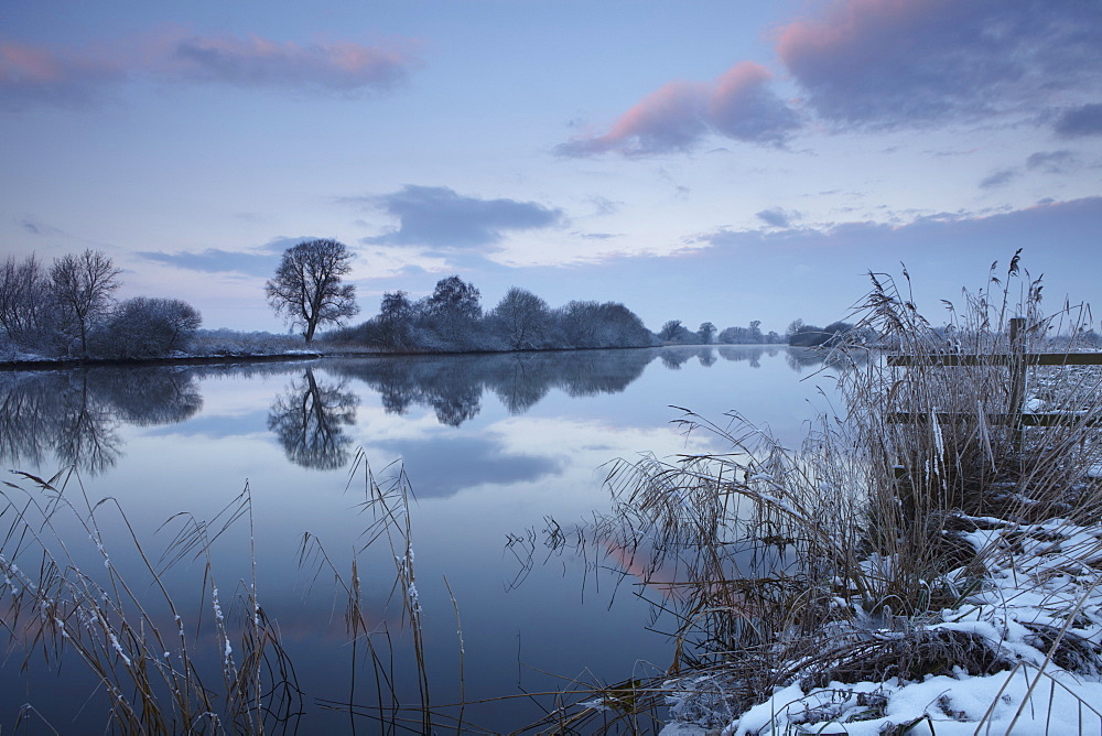 A mirror calm River Yare on a winter morning at Strumpshaw Fen, Norfolk, England, United Kingdom, Europe