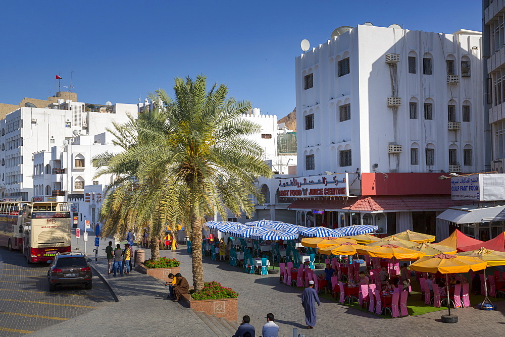 Evening view of restaurants on the Corniche at Muttrah, Muscat, Oman, Middle East