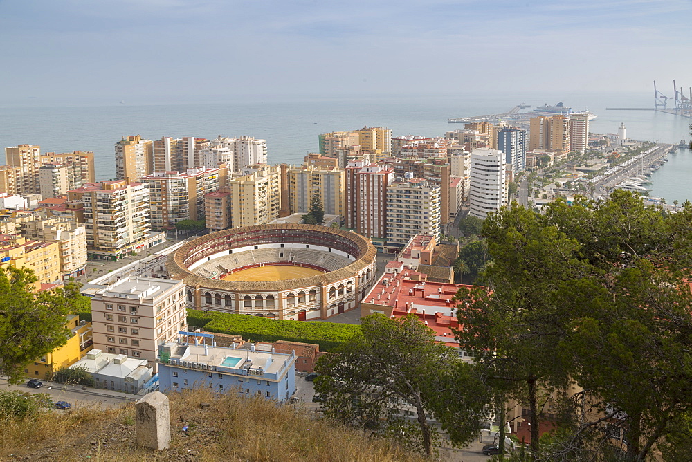 View of Plaze de Toros and harbour from the ruins of the Moorish castle fortress high atop Mount Gibralfaro, Malaga, Costa del Sol, Andalusia, Spain, Europe